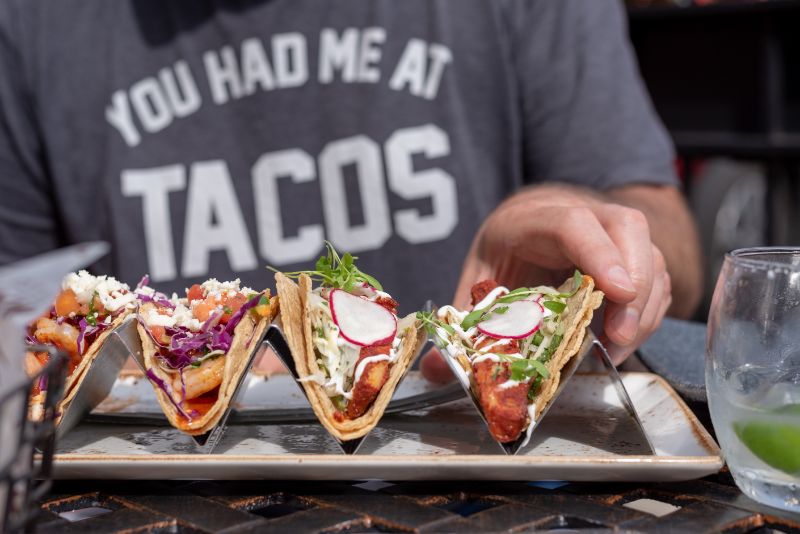 Foodie Eating a Plate of Tacos