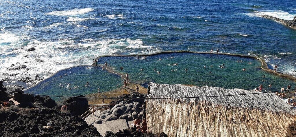 Tourists swim at the Canary Islands El Hierro