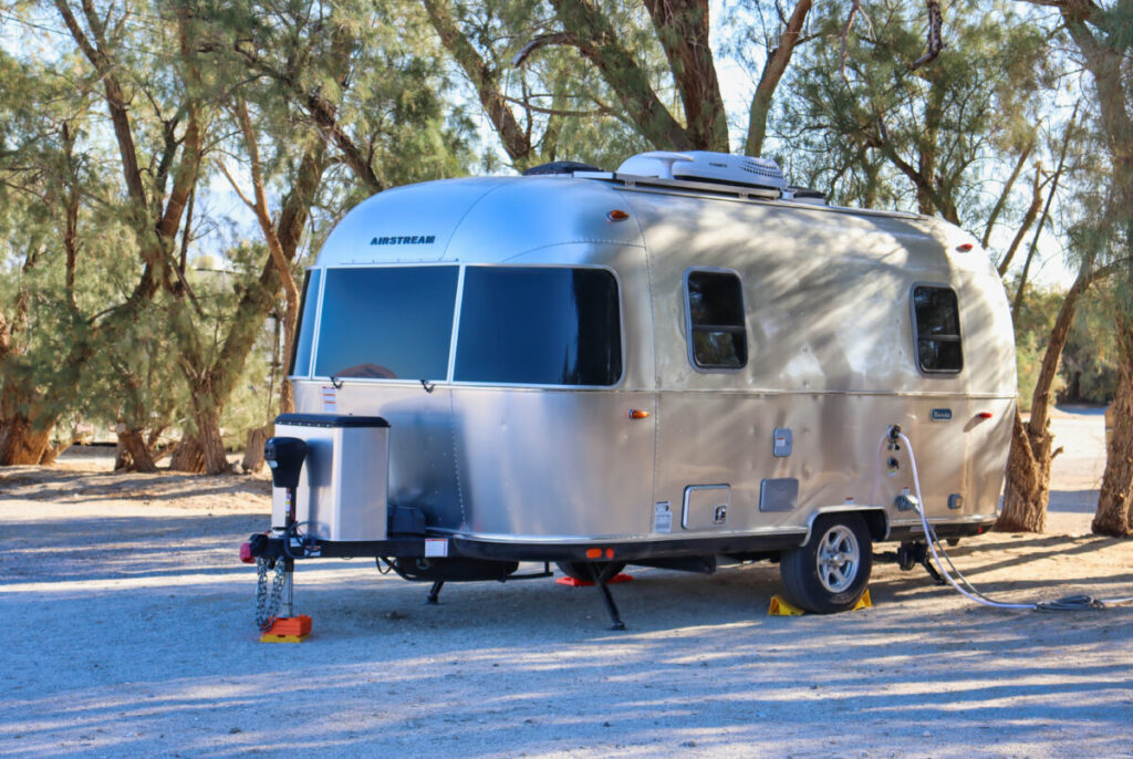 Close-up of Airstream Bambi camper parked at an RV Park in Borrego Springs, California