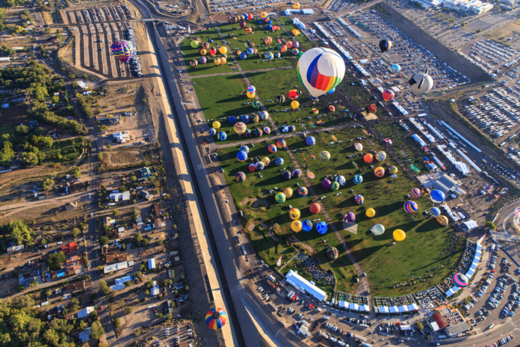 Aerial view of the balloons slowly floating up in the sky during the Albuquerque Balloon Fiesta