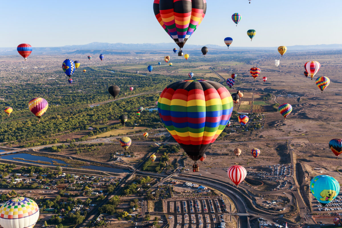 Colorful hot air balloons floating into the sky during the Albuquerque Balloon Fiesta