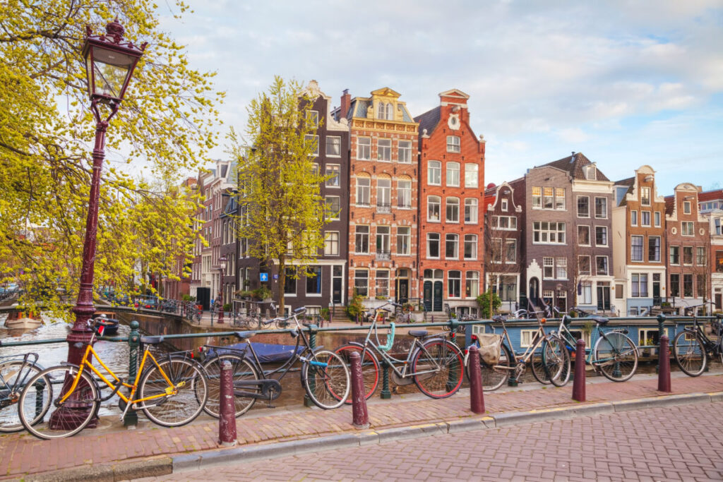 Rows of parked bicycles on a bridge in Amsterdam, Netherlands