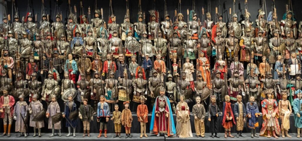 Colorful puppets displayed at the Antonio Pasqualino International Puppet Museum, showcasing various styles and cultures
