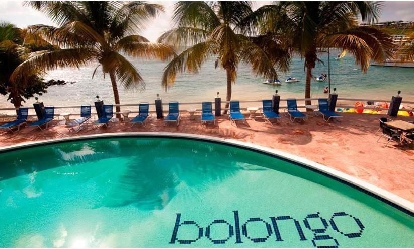 Private beach area at Bolongo Bay Beach Resort with loungers and water sports equipment