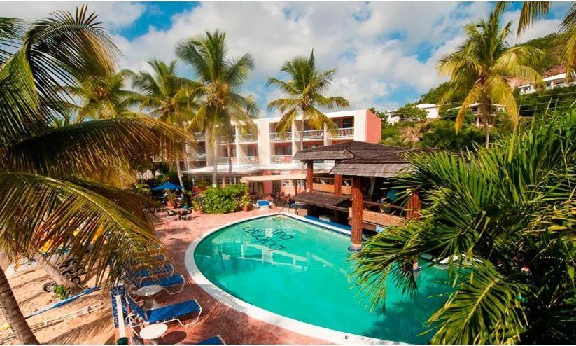 Bolongo Bay Beach Resort pool area with oceanfront dining and tropical landscaping