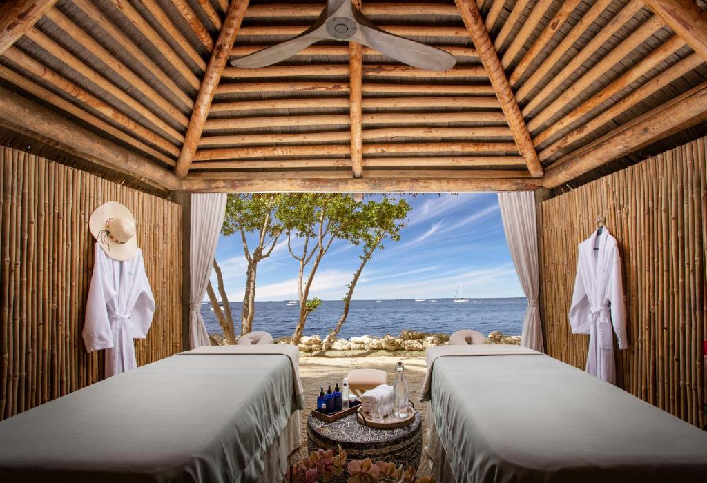 Serene spa treatment room at Bungalows Key Largo with ocean views and natural decor