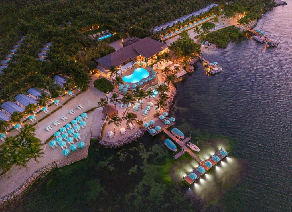 Luxury overwater bungalows at Bungalows Key Largo resort surrounded by turquoise waters