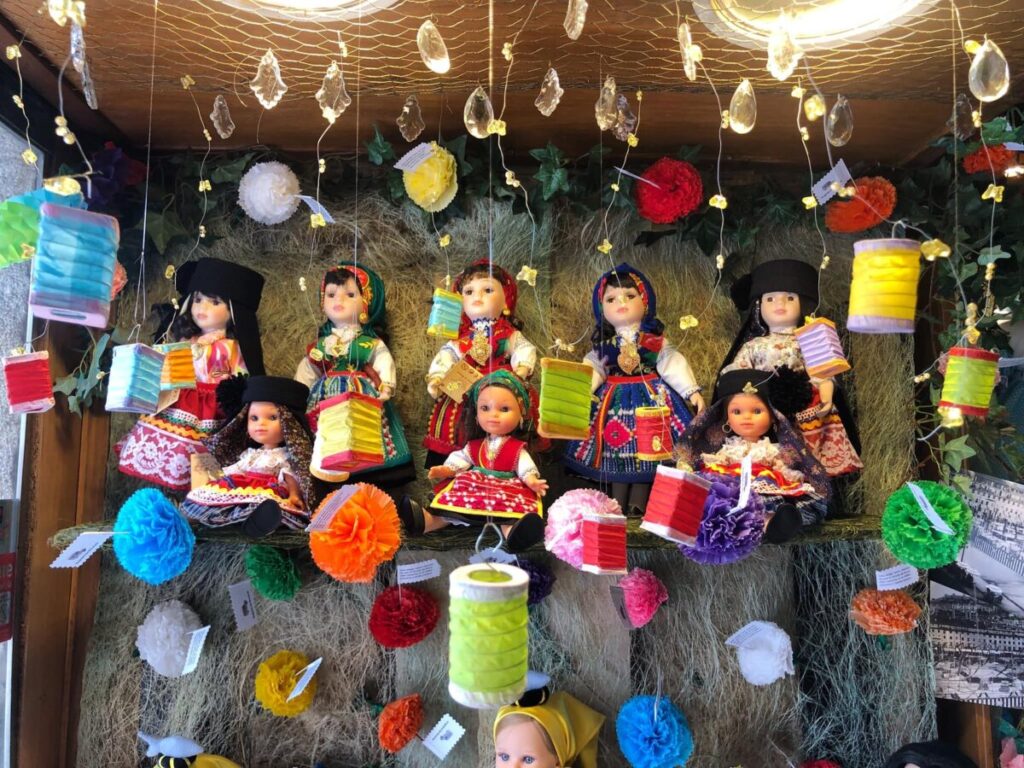 Display of various dolls at the Doll Hospital in Lisbon, Portugal, showcasing their unique designs and charming features
