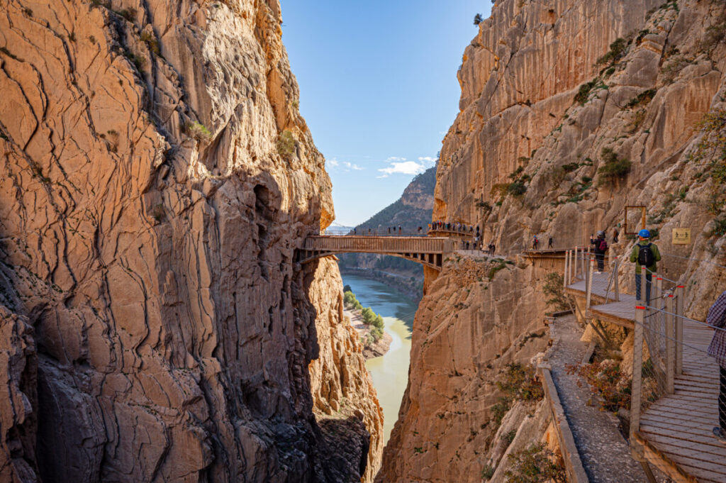 Tourists hiking the El Caminito del Rey walkway in Spain