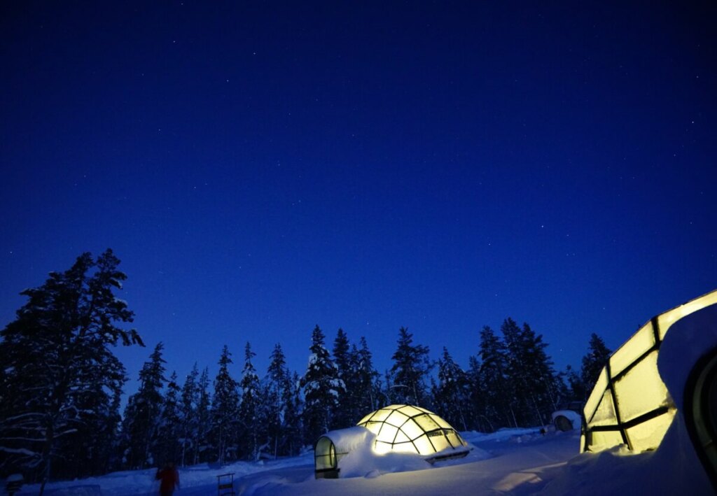 Close-up of two glass igloos at night in Finland