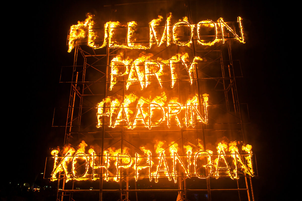 Fire dancers performing at Full Moon Party on Haad Rin Beach Koh Phangan
