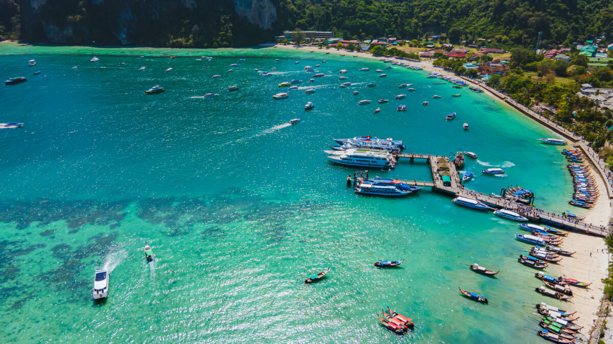 Aerial view of Koh Phi Phi's turquoise waters and limestone cliffs perfect for water adventures