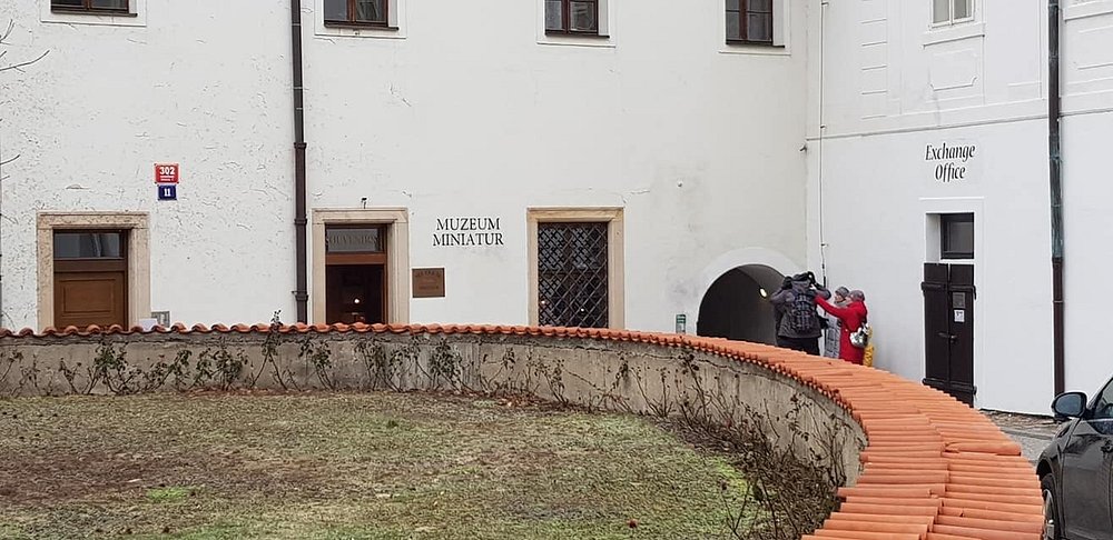 Exterior view of the Museum of Miniatures in Prague, showcasing its unique architecture and inviting entrance