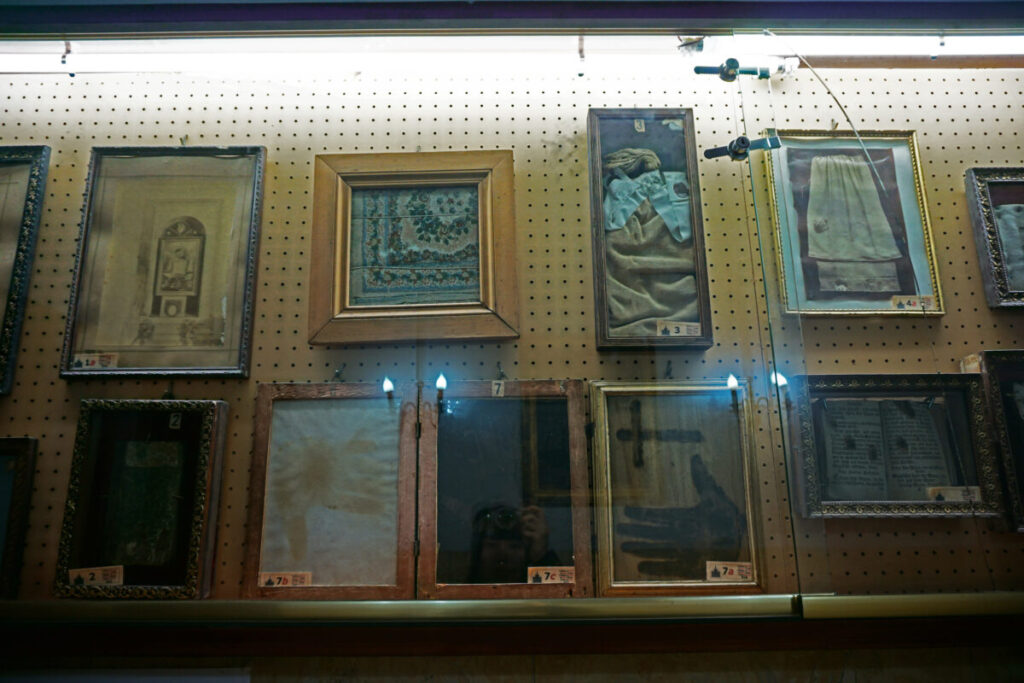 Display of artifacts in the vestry of Chiesa del Sacro Cuore del Suffragio, part of the Museo delle Anime del Purgatorio, Rome