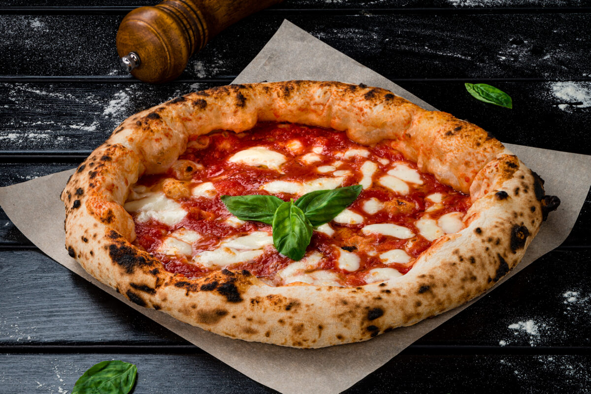 Neapolitan Italian pizza with mozzarella and basil