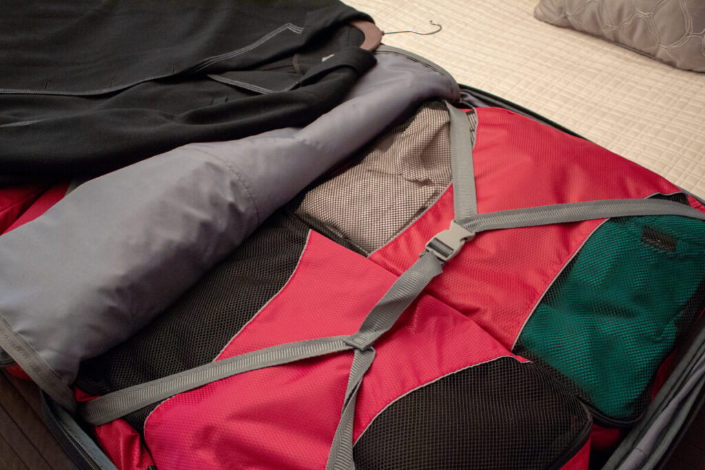 Packing cubes inside an open travel suitcase