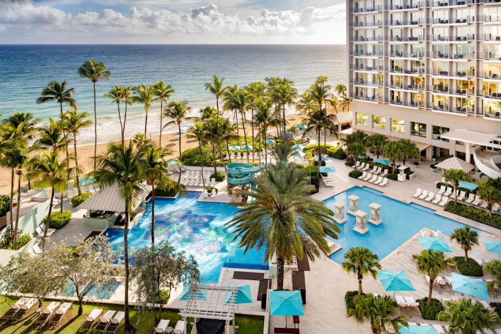 Beachfront San Juan Marriott Resort with palm trees and Caribbean ocean views