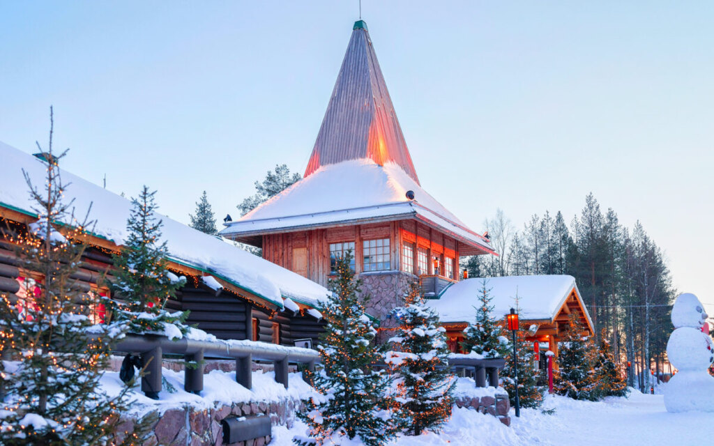 Santa Office, Christmas trees, and a snowman at Santa Claus Village in Rovaniemi, Lapland, Finland