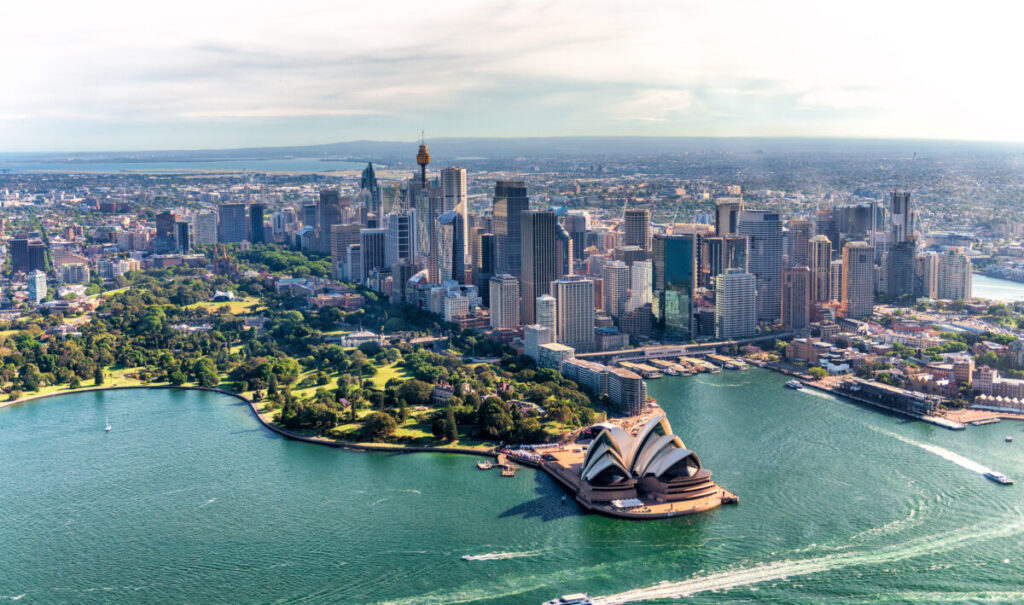 Aerial view showcasing Sydney Harbor and the iconic Downtown Skyline, highlighting the beauty of Australia’s urban landscape