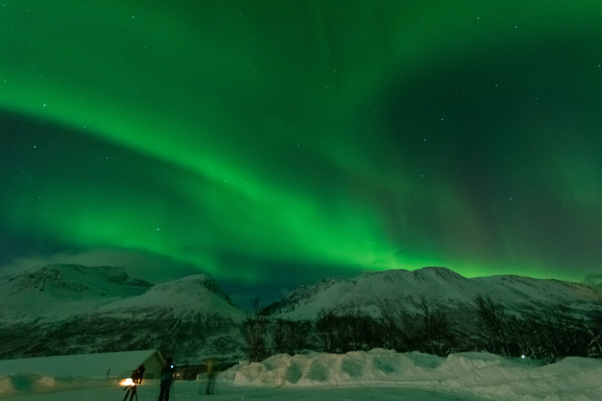 Northern lights over snowy mountain in winter,Tromso,Norway